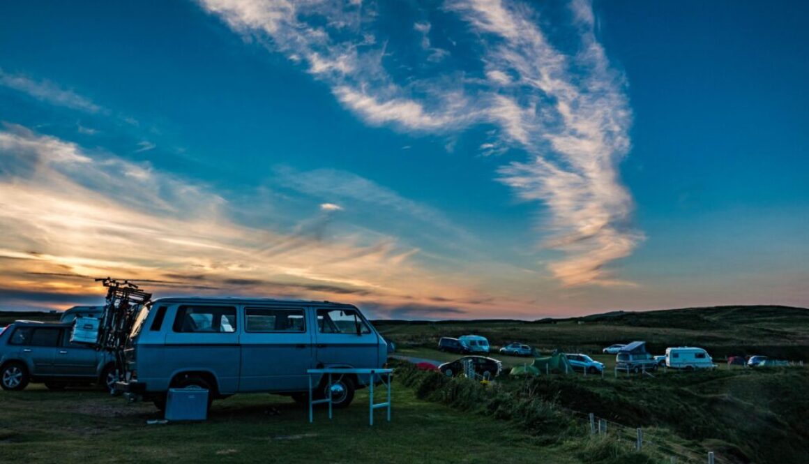 Campervan, on the left, facing right, looking over a campsite